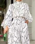 ABSTRACT FIGURE PRINT LONG SLEEVE WIDE LEG JUMPSUIT - Missyess