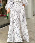 ABSTRACT FIGURE PRINT LONG SLEEVE WIDE LEG JUMPSUIT - Missyess