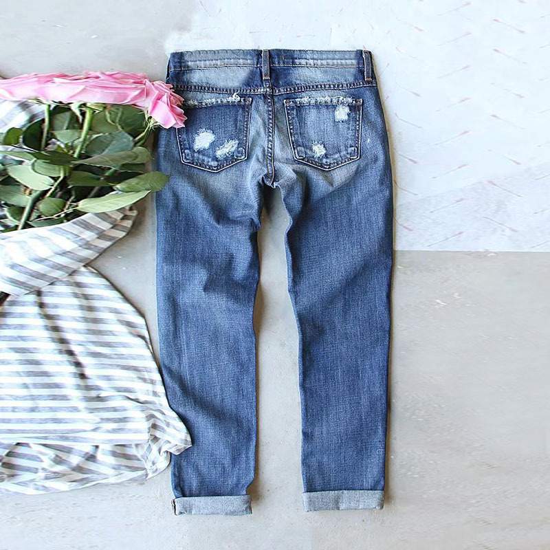 Fashionable Ripped Jeans with Floral Embellishments